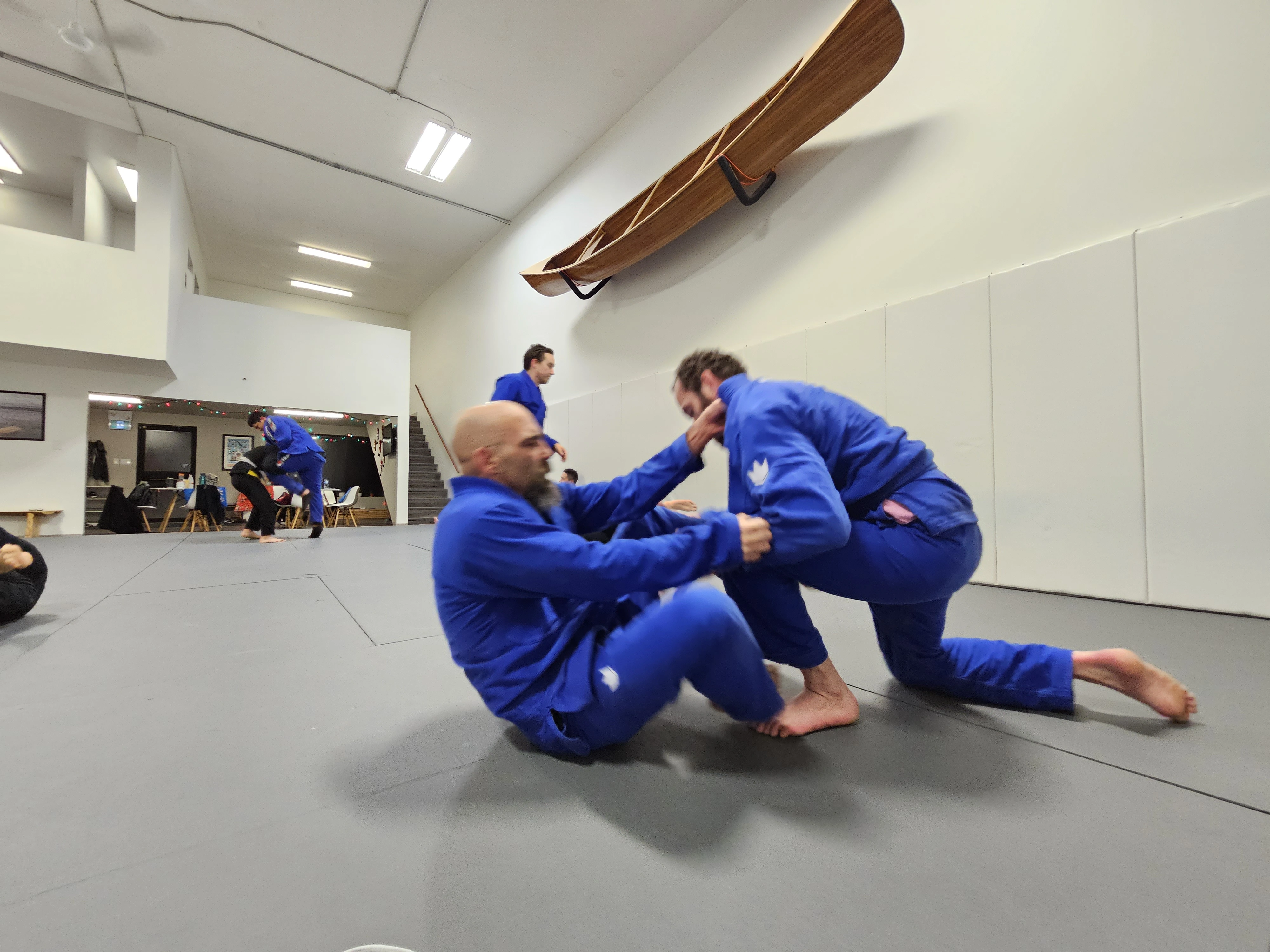 Adults training GI Brazilian Jiu-Jitsu at Expedition BJJ in Regina