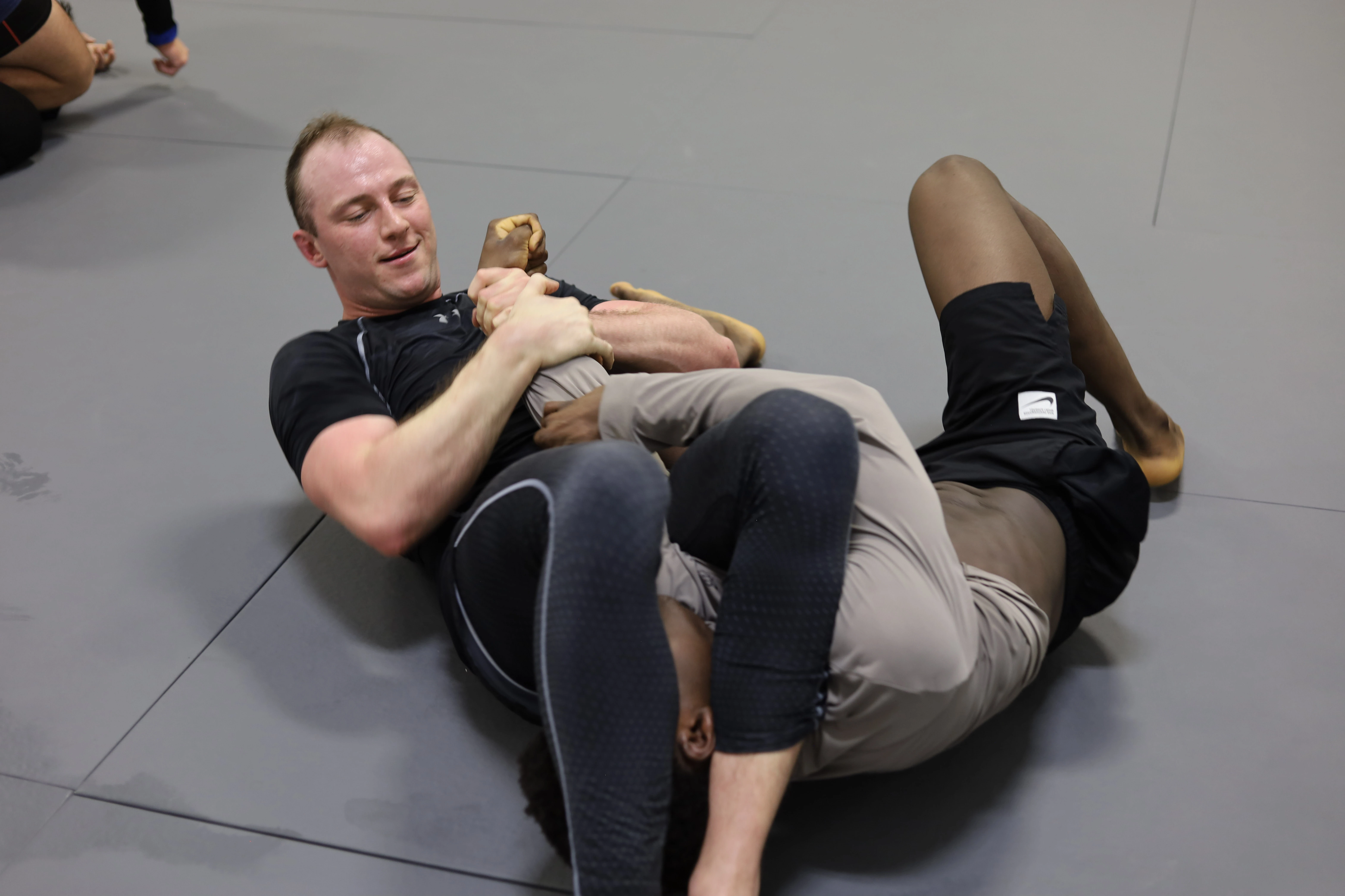 Armbar submission technique during a Jiu-Jitsu competition match