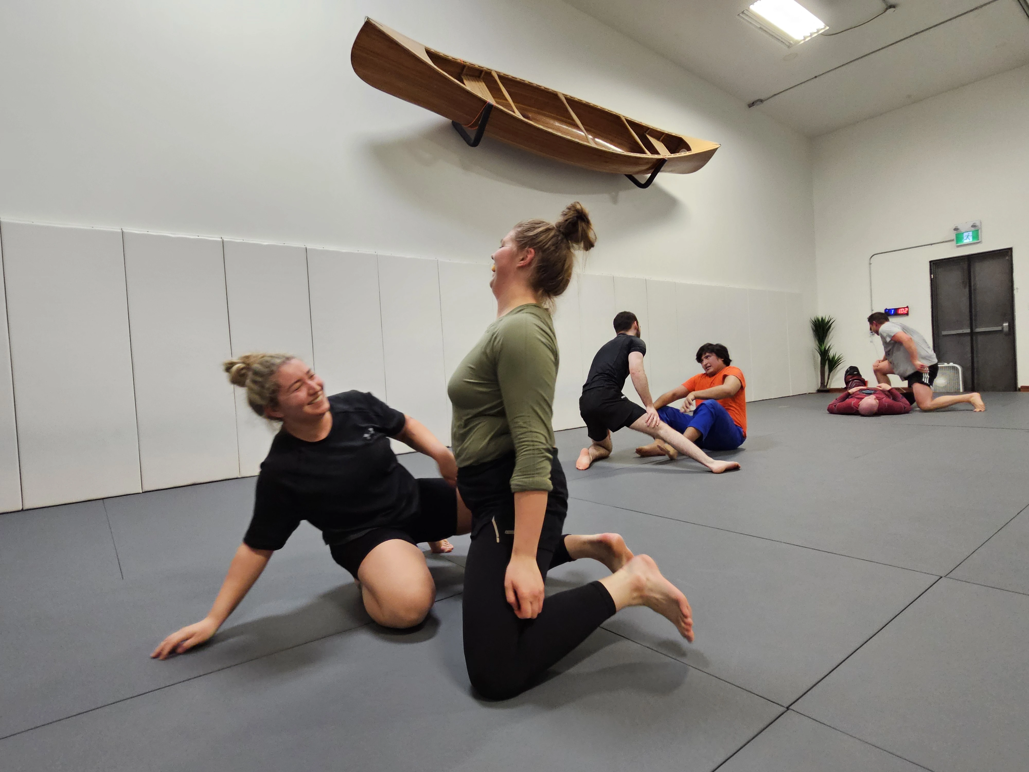 Fun moment between training partners at Expedition BJJ, showing the community spirit